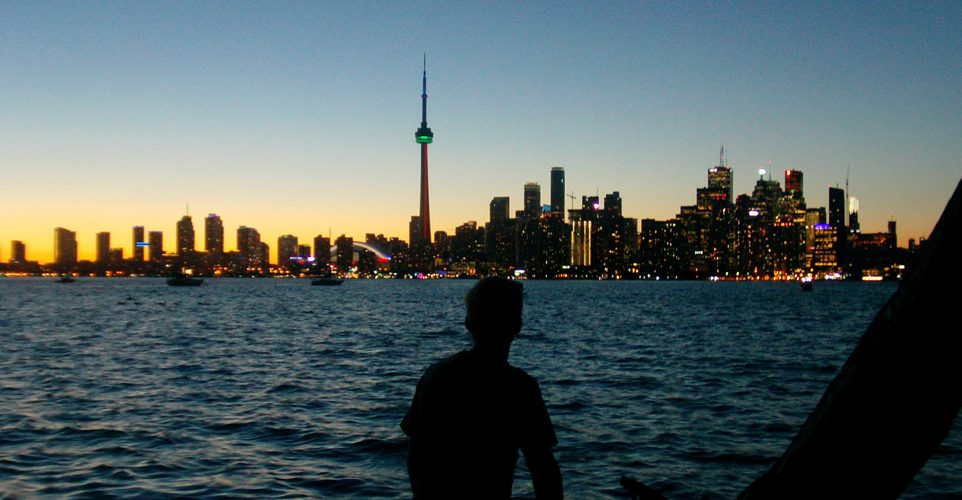 Participant looking back on Toronto from the island at sunset HEADER jpg 962x500