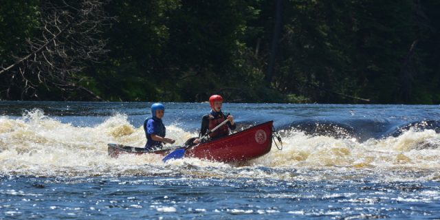 two paddlers navigate some fun whitewater HEADER 1 640x320